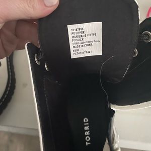 White and black Torrid combat boots